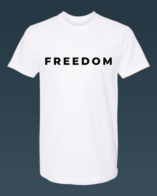 White t-shirt with 'FREEDOM' printed on it against a dark background