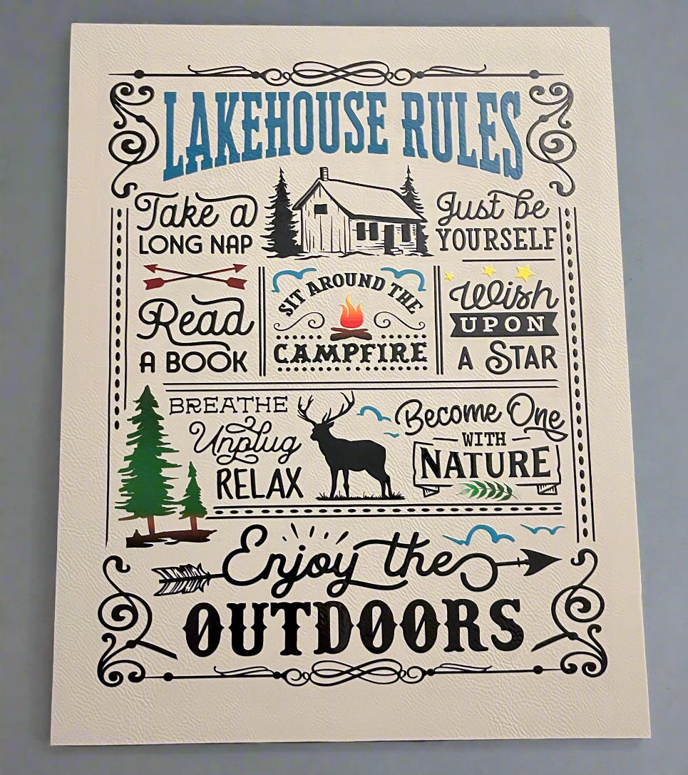 Lakehouse Rules wall art with cabin, trees, and nature-themed text on a gray background