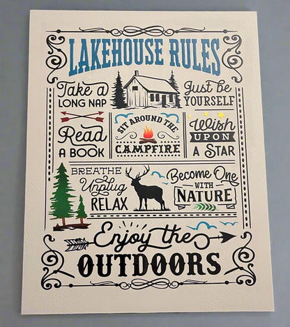 Lakehouse Rules wall art with cabin, trees, and nature-themed text on a gray background